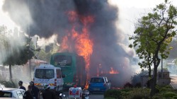 Flames rise at the scene where an explosion tore through a bus in Jerusalem