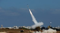 An Iron Dome launcher fires an interceptor rocket in the southern Israeli city of