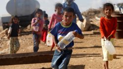 Palestine children carrying water
