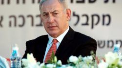 Israeli Prime Minister Benjamin Netanyahu looks on during a visit at the "Tamra HaEmek" elementary school on the first day of the school year, in the Arab Israeli town of Tamra, Israel September 1,