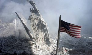 An American flag flies near the base of the destroyed World Trade Center in New York on September 11 2001