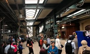 Onlookers view a New Jersey Transit train that derailed and crashed through the station in Hoboken, New Jersey, U.S. in this picture courtesy of David Richman taken