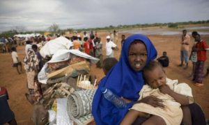 starving migrants on road to find safety and food