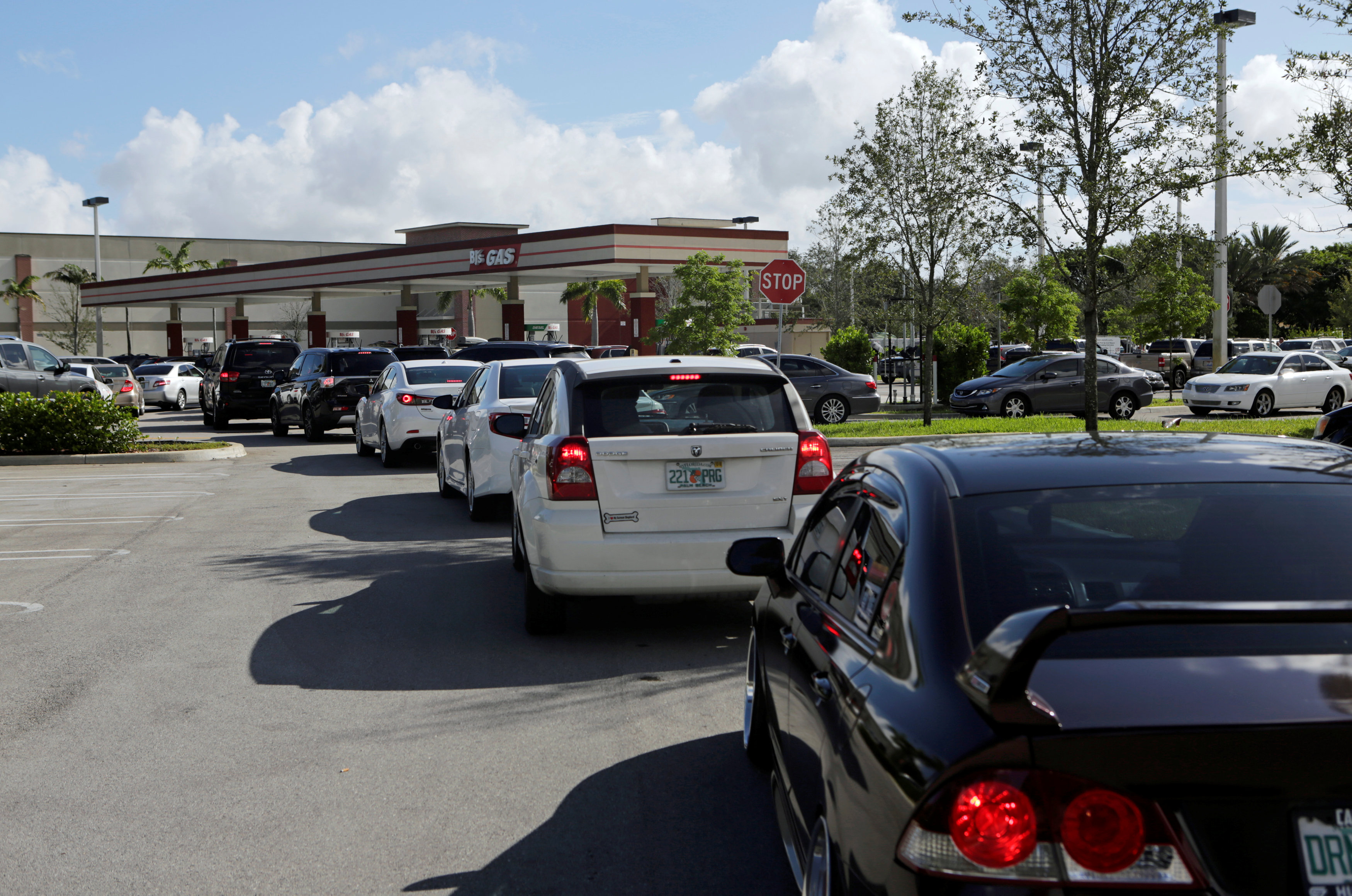 People line up to fill their cars with gas in anticipation of Hurricane Matthew, in Coral Springs, Florida,