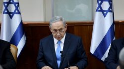 Israeli Prime Minister Benjamin Netanyahu opens the weekly cabinet meeting at his Jerusalem office moments after he was informed about a shooting attack in Jerusalem