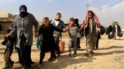 A family fleeing fighting between the Islamic State and Iraqi army in Intisar disrict of eastern Mosul, make their way to safer territory, Iraq