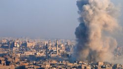 Smoke rises as seen from a governement-held area of Aleppo, Syria