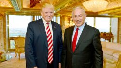 Israeli Prime Minister Benjamin Netanyahu (R) stands next to Donald Trump during their meeting in New York,