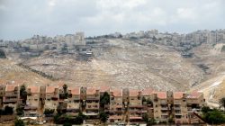Houses are seen in the West Bank Jewish settlement of Maale Adumim as the Palestinian village of Al-Eizariya is seen in the background