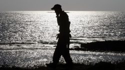 Israeli soldier calling his mother on mobile phone