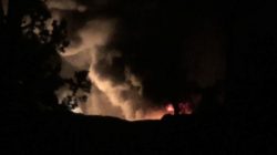 Smoke and flames are seen at military airport near Damascus, Syria