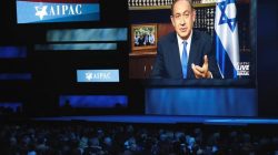 Israeli Prime Minister Benjamin Netanyahu speaks via a video link from Israel. REUTERS/Joshua Roberts