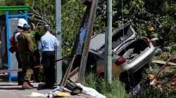 Israeli forces inspect the scene of a Palestinian car ramming attack near the Jewish settlement of Ofra near the West Bank city of Ramallah April 6, 2017. REUTERS/ Ammar Awad