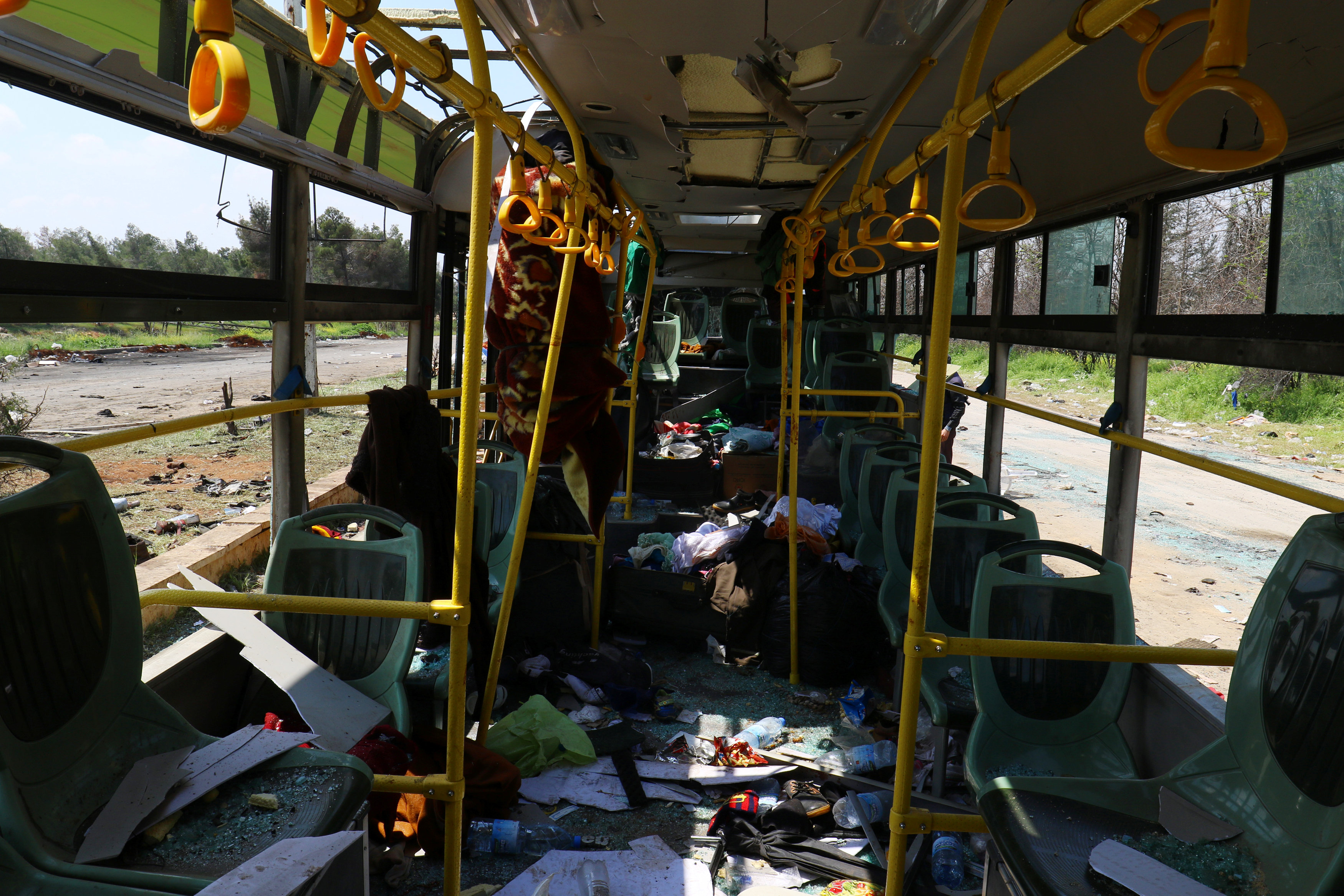 The interior of a damaged bus is seen after an explosion yesterday at insurgent-held al-Rashideen, Aleppo province, Syria