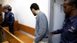 An U.S.-Israeli teen, who was arrested in Israel on suspicion of making bomb threats against Jewish community centres in the United States, Australia and New Zealand, arrives before the start of a remand hearing at Magistrate's Court in Rishon Lezion, Israel April 20, 2017. REUTERS/ Amir Cohen