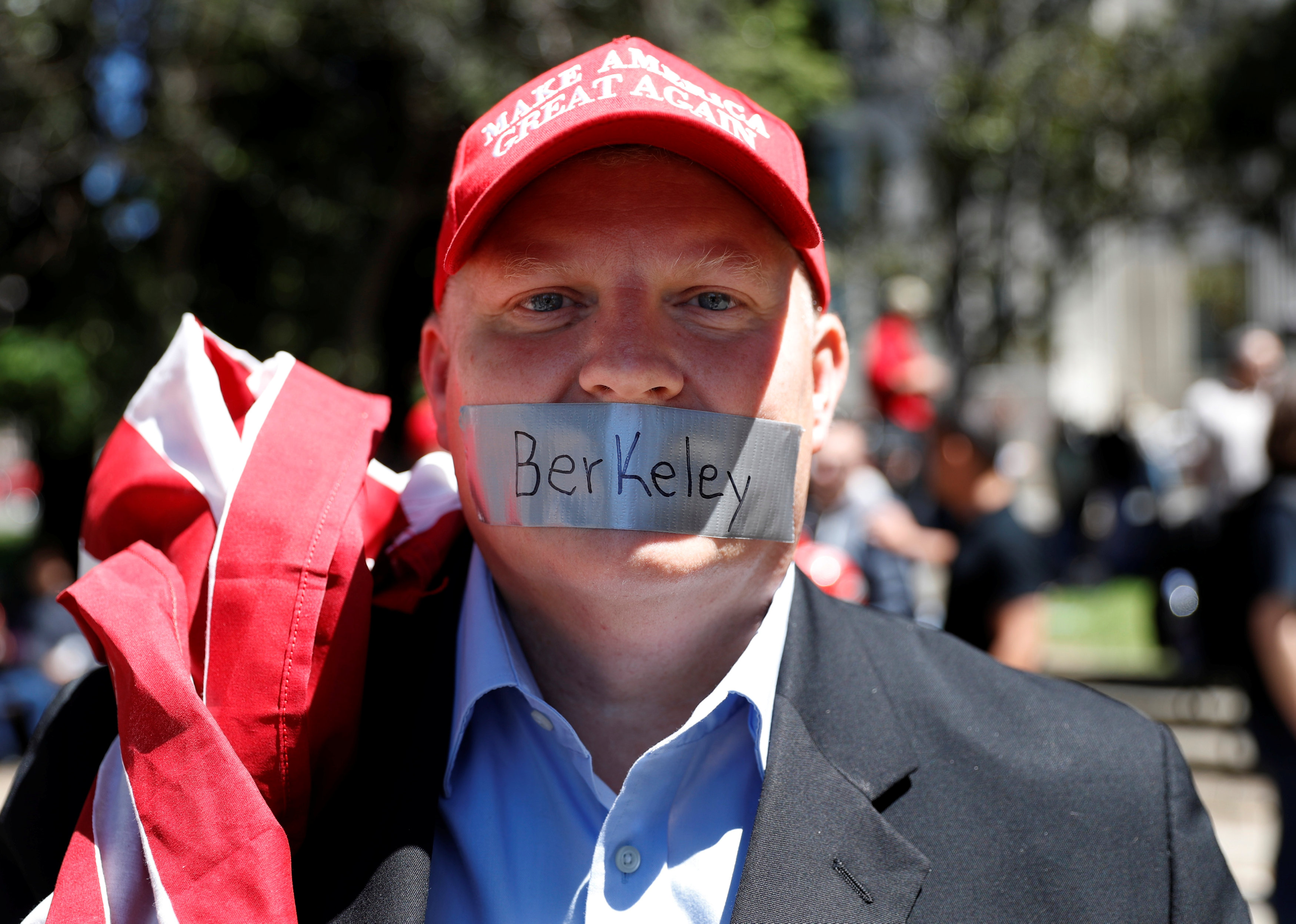 A man looks on as opposing factions gather over the cancelation of conservative commentator Ann Coulter's speech at the University of California, Berkeley, in Berkeley, California, U.S., April 27, 2017. REUTERS/Stephen Lam