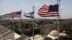 American and Israeli flags flutter in the wind atop the roof of the King David Hotel, in preparation for the upcoming visit of President Trump to Israel, in Jerusalem. REUTERS/Ronen Zvulun