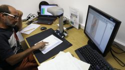 A researcher scans declassified documents for Akevot, an Israeli NGO researching the Israeli-Palestinian conflict, at the Central Zionist Archives in Jerusalem May 10, 2017. Picture taken May 10, 2017. REUTERS/Ronen Zvulun
