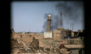 Al-Hadba minaret at the Grand Mosque is seen through a building window in the old city of Mosul, Iraq June 1, 2017. REUTERS/Alaa Al-Marjani