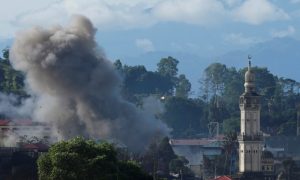 An explosion is seen after Philippines army airstrike as government troops continue their assault against insurgents from the Maute group in Marawi City, Philippines June 28, 2017. REUTERS/Jorge Silva