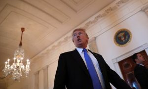 U.S. President Donald Trump reacts as he leaves a Made in America roundtable meeting in the East Room of the White House in Washington, U.S. July 19, 2017. REUTERS/Carlos Barria