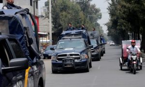 Police vehicles patrol the streets, after suspected gang members were killed on Thursday in a gun battle with Mexican marines in Mexico City, Mexico, July 21, 2017. REUTERS/Henry Romero