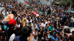 People attend the funeral of Mohammad Jawawdah in Amman, Jordan July 25, 2017. REUTERS/Muhammad Hamed