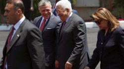 Jordan's King Abdullah II walks with Palestinian President Mahmoud Abbas during a reception ceremony in the West Bank city of Ramallah, August 7, 2017.