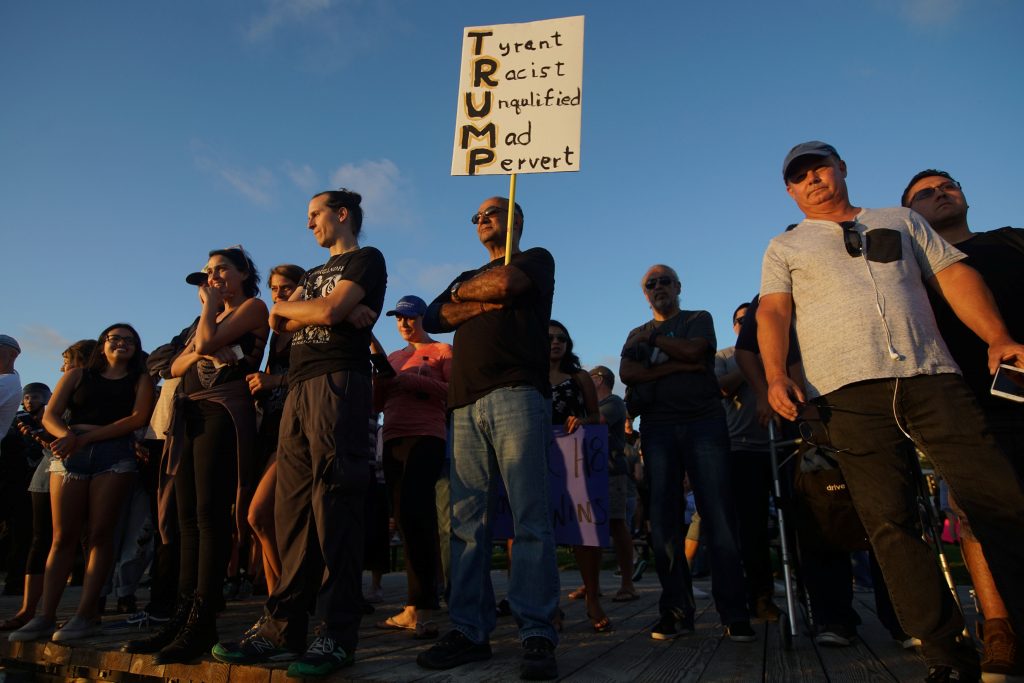 'America First' protesters face off with opponents at California beach