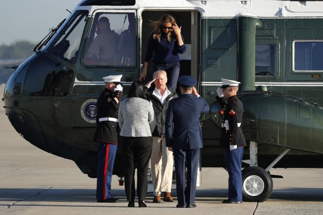 U.S. President Donald Trump salutes as he and first lady Melania Trump arrive to board Air Force One for travel to Puerto Rico, from Joint Base Andrews, Maryland, U.S., October 3, 2017. REUTERS/Jonathan Ernst