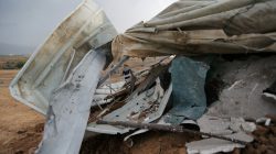 A Palestinian man surveys the scene of an Israeli airstrike at a Hamas outpost in the central Gaza Strip October 9, 2017. REUTERS/Ibraheem Abu Mustafa