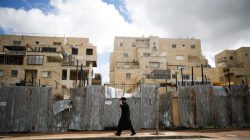 An ultra-Orthodox Jewish man walks on a road in the Israeli settlement of Beitar Illit in the occupied West Bank