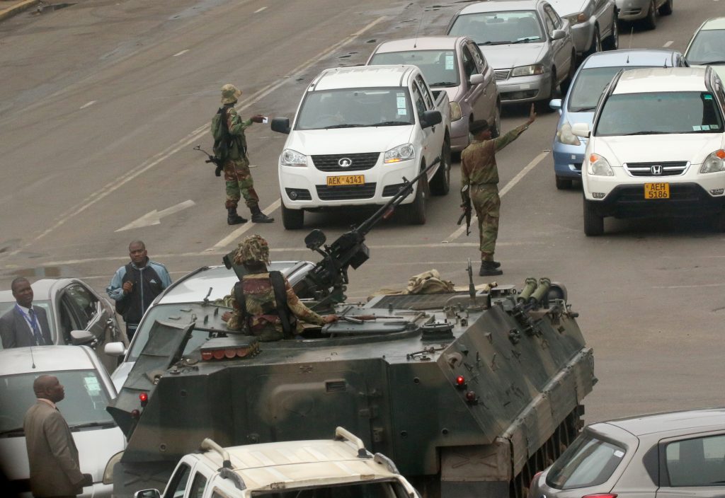 Zimbabwe's army seizes power, Mugabe confined but "safe"