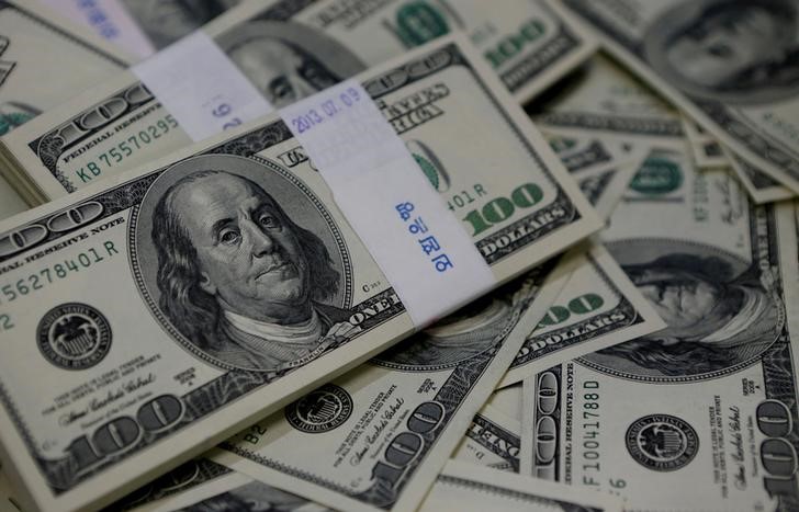 Dollar drops on disappointing U.S. inflation data