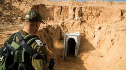 An Israeli soldier stands next to an entrance to what the Israeli military say is a cross-border attack tunnel dug from Gaza to Israel, on the Israeli side of the Gaza Strip border near Kissufim, Israel January 18, 2018