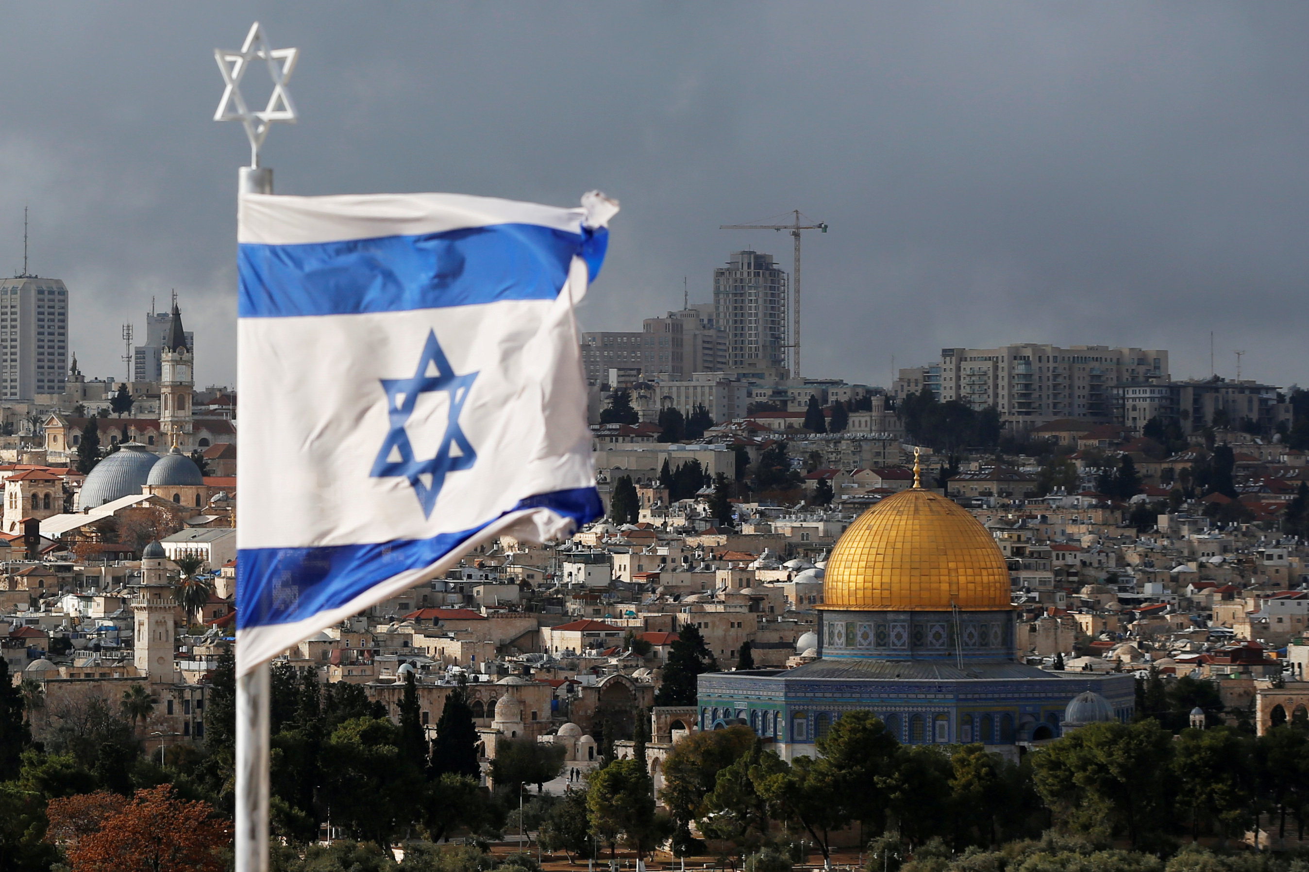 An Israeli flag is seen near the Dome of the Rock, located in Jerusalem's Old City on the compound known to Muslims as Noble Sanctuary and to Jews as Temple Mount December 6, 2017.