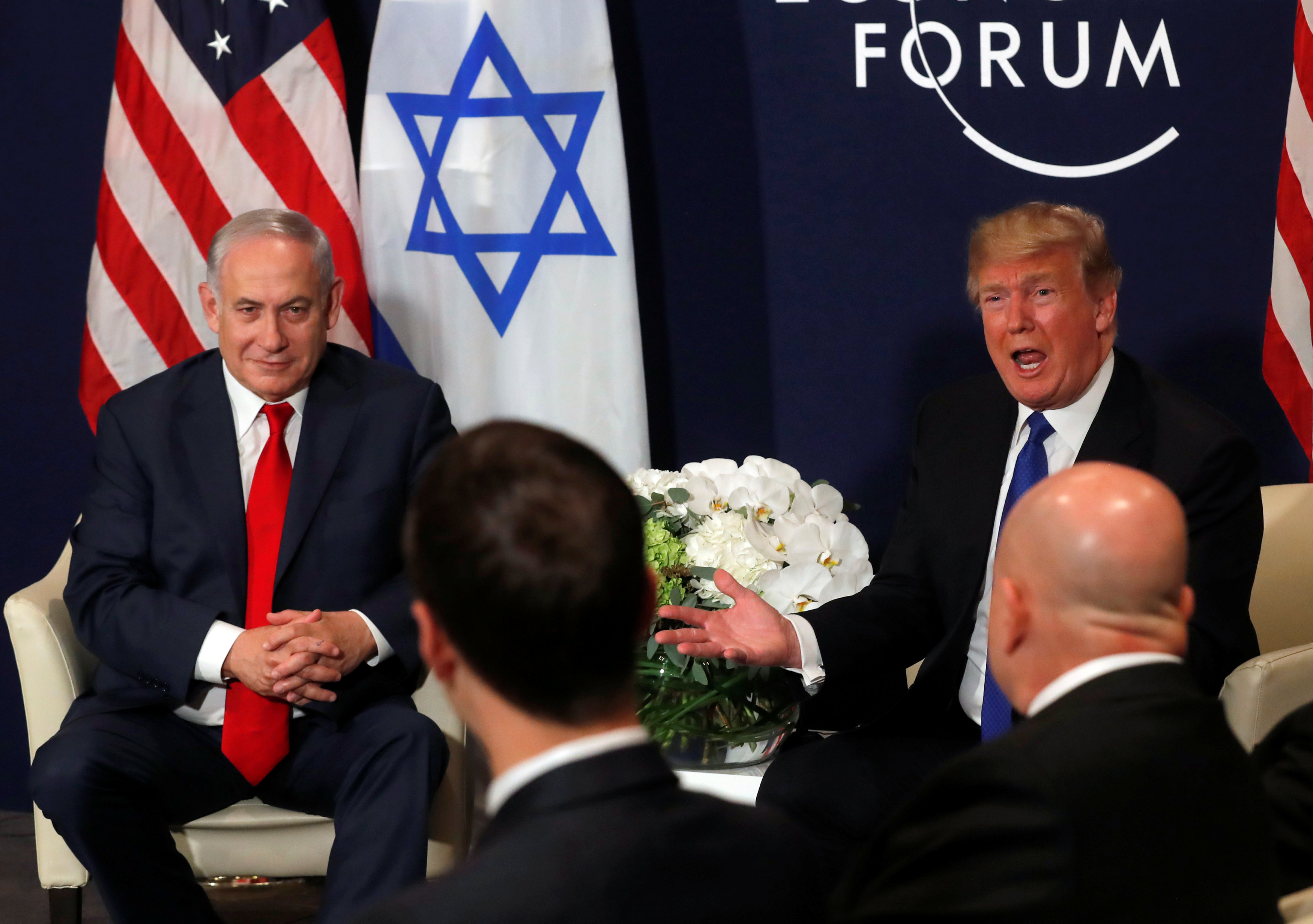 FILE PHOTO - U.S. President Donald Trump speaks with Israeli Prime Minister Benjamin Netanyahu during the World Economic Forum (WEF) annual meeting in Davos, Switzerland January 25, 2018. REUTERS/Carlos Barria