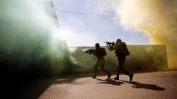 U.S. Marine and an Israeli soldier practice urban combat during Juniper Cobra, a U.S.-Israeli joint air defence exercise, in Zeelim, southern Israel, March 12, 2018. REUTERS/Amir Cohen
