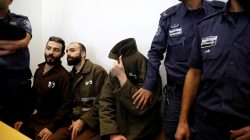Romain Franck, an employee of the French consulate-general in Jerusalem, appears with co-defendants in the district court in Beersheba, Israel, March 19, 2018. REUTERS/Amir Cohen