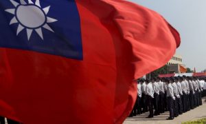 FILE PHOTO: Members of the National Security Bureau take part in a drill next to a national flag at its headquarters in Taipei, Taiwan, November 13, 2015. REUTERS/Pichi C