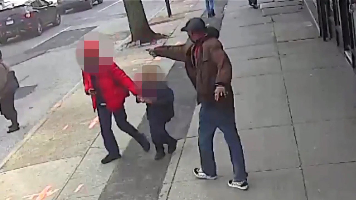 Saheed Vassell points a metal pipe at a pedestrian in Brooklyn April 4, 2018, in a still image from surveillance video released by the New York Police Department in New York City, New York, U.S. on April 5, 2018. Images of some faces have been obscured at source. NYPD/Handout via REUTERS