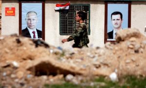 FILE PHOTO: A Syrian soldier loyal to President Bashar al Assad is seen outside eastern Ghouta, in Damascus, Syria February 28, 2018. To match Special Report RUSSIA-FLIGHTS/ REUTERS/Omar Sanadiki/File Photo