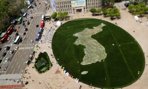 The shape of the Korean peninsula is seen on the lawn in front of City Hall ahead of the upcoming summit between North and South Korea in Seoul, South Korea April 25, 2018. REUTERS/Jorge Si