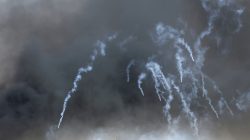 Tear gas canisters are fired by Israeli troops at Palestinian demonstrators during clashes at a protest demanding the right to return to their homeland, at the Israel-Gaza border in the southern Gaza Strip. REUTERS/Ibraheem Abu Mustafa