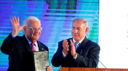 Israeli Prime Minister Benjamin Netanyahu claps after handing U.S. Ambassador to Israel David Friedman a letter of appreciation, during a reception held at the Israeli Ministry of Foreign Affairs in Jerusalem, ahead of the moving of the U.S. embassy to Jerusalem, May 13, 2018. REUTERS/Amir Cohen