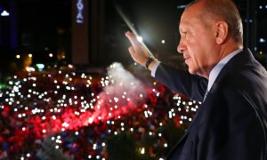 Turkish President Tayyip Erdogan greets his supporters from the balcony of his ruling AK Party headquarters in Ankara, Turkey, early June 25, 2018. Kayhan Ozer/Presidential Palace/Handout via REUTERS