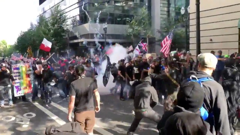 Protesters of the right-wing group Patriot Prayer clash with protesters from anti-fascist groups during a demonstration in Portland, Oregon, U.S. June 30, 2018, in this still image taken from video from obtained from social media. MANDATORY CREDIT. Bryan Colombo/via REUTERS