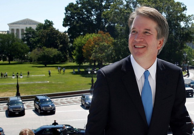 With the U.S. Supreme Court building in the background, Supreme Court nominee judge Brett Kavanaugh arrives prior to meeting with Senate Majority Leader Mitch McConnell on Capitol Hill in Washington, U.S., July 10, 2018. REUTERS/Joshua Roberts