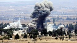 An explosion is pictured at Quneitra at the Syrian side of the Israeli Syrian border, as seen from the Israeli-occupied Golan Heights, July 22. REUTERS/Ronen Zvulun