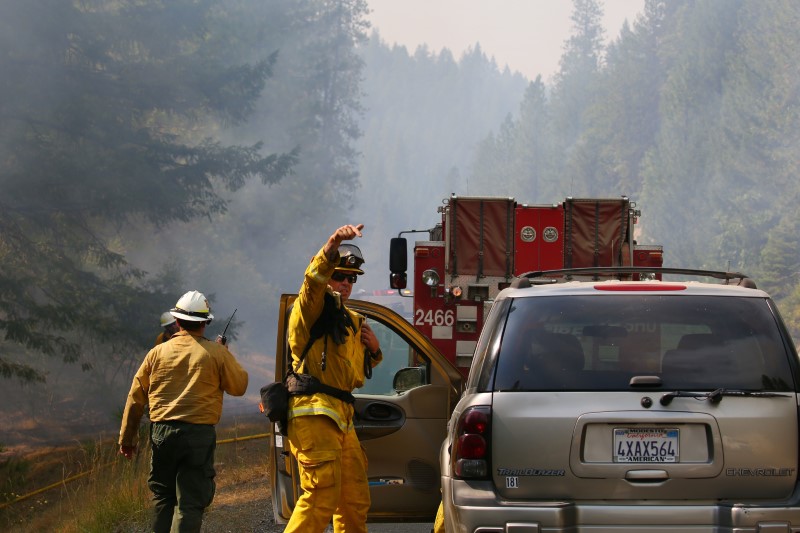 Jul 30, 2018; Redding, CA, USA; Firefighters monitor fire movement as it crosses Highway 299 just west of Buckhorn Summit near the Trinity County line. Firefighters made progress on the fire which is now at 20 percent containment. Kelly Jordan via USA TODAY NETWORK